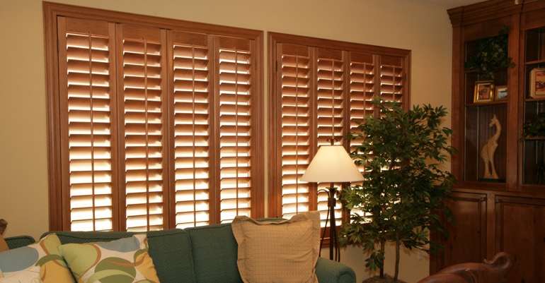 Natural wood shutters in Chicago living room.